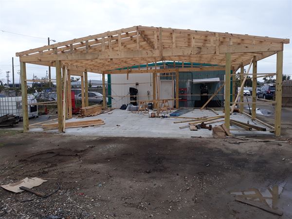 Commercial building being rebuilt with new wood roof framing